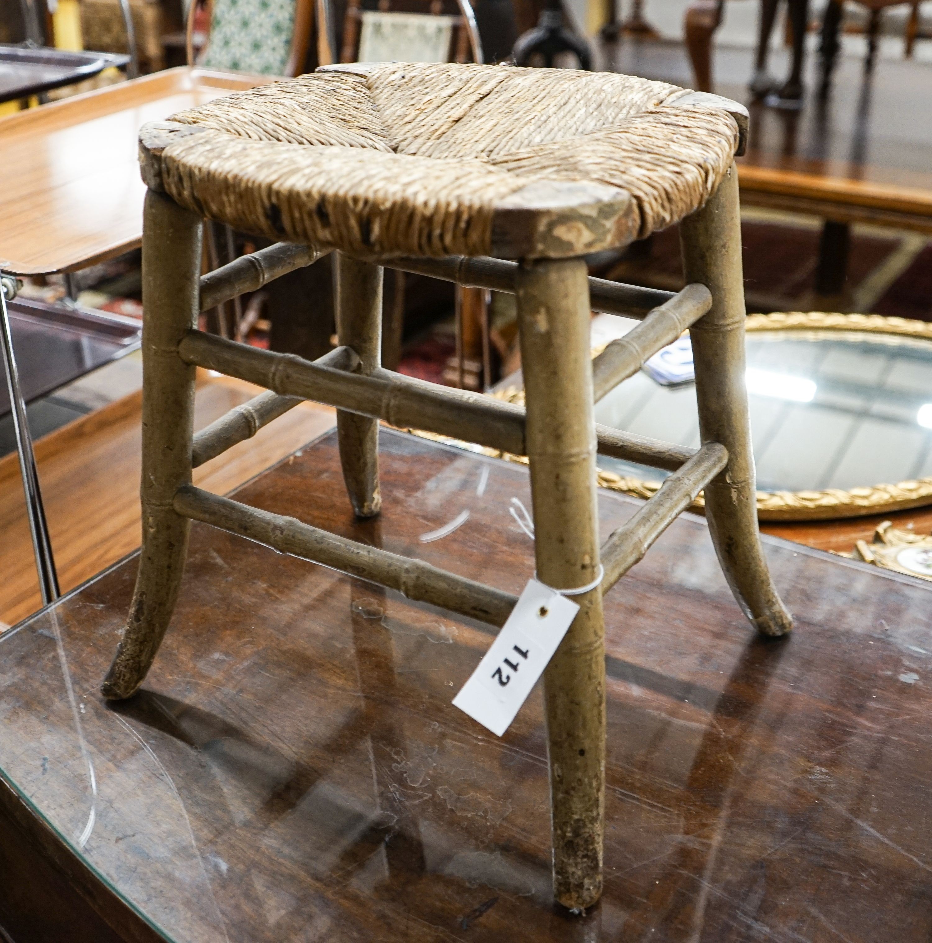 A Regency provincial rush seat simulated bamboo stool, width 34cm, depth 28cm, height 35cm